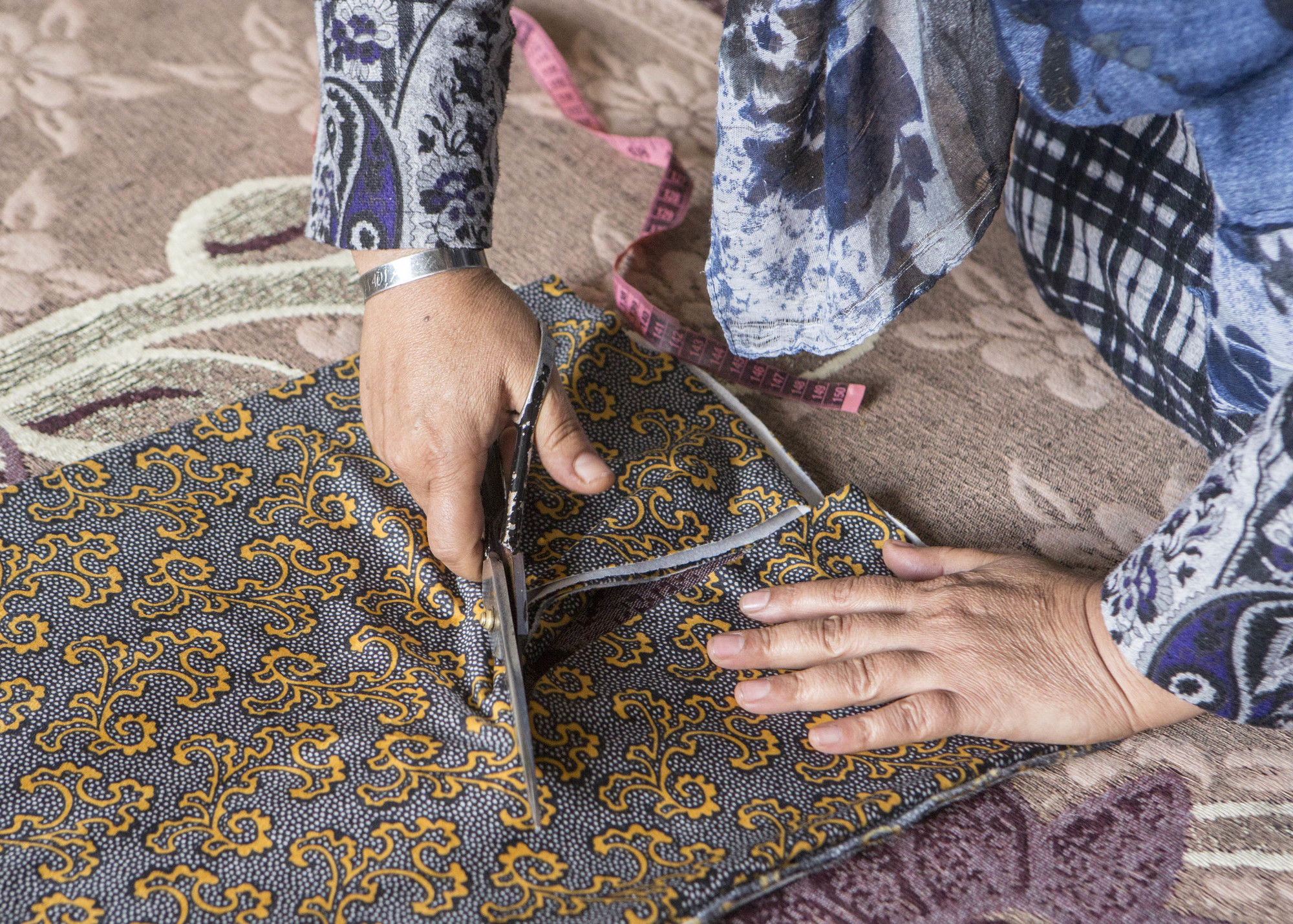 Shireen sewing a dress. Photo: Alison Baskerville