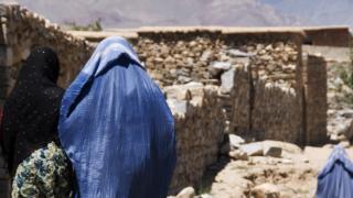 A woman in Afghanistan, where food prices are leaving people in debt in order to feed their families. Photo credit: Jenny Matthews