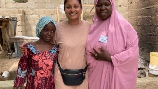 Preeya pictured with Stronger Women, Stronger Nations programme participant, Zainab, and her daughter Habiba. Zainab was abandoned by her husband, left alone with six children. Through our programme, she was referred to a lawyer and now has an open case against her husband to prosecute him. Photo credit: Women for Women International