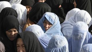 Women wearing burqas.
