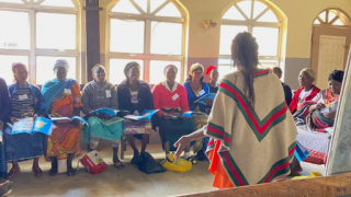 One group of women in our Stronger Women, Stronger Nations programme at a training centre. Here, they are in social empowerment training learning about mental health with their trainer, Jemima. Photo credit: Women for Women International