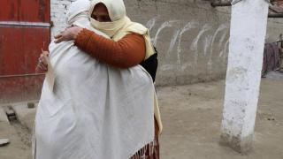 Women for Women International programme participants in Afghanistan hugging as they reunite after our centres re-opened. Photo credit: Women for Women International