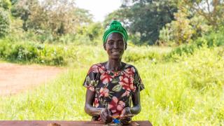 In South Sudan, Kiden is counting some of her profits after a bakery skills/social empowerment training class. Credit: Charles Atiki Lomodong