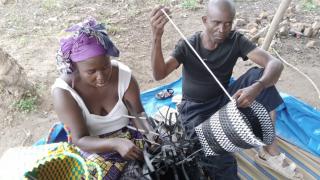 Amissi weaving with her husband. Photo: Women for Women International