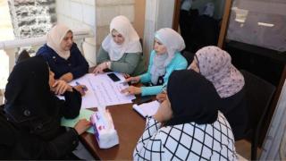 Syrian women talking about social empowerment in training provided by Women Now for Development.