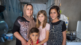 Seve, a refugee woman from Iraq, and her family.