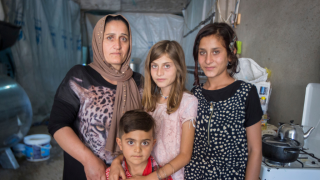 Seve and her family in Khanke camp in the Kurdistan Region of Iraq in 2016. Photo: Alison Baskerville