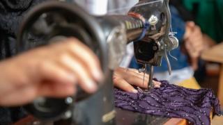 Woman tailoring in Afghanistan. Photo: Women for Women International