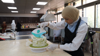 Programme participant during sweets and pastries production training. Photo: Women for Women International