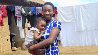 Nerat with her son, Bright. Nerat is a participant of the Adolescent Girls programme in Nigeria. Photo: Women for Women International