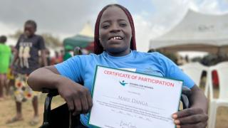 Mary with her Stronger Women, Stronger Nations programme certificate. Photo: Women for Women International