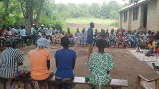 Stephen Batali speaks to community members during a session in Longamere village, Yei County. Photo: Women for Women International