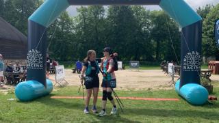Natalie and her friend cross the finish line hand in hand - showing the true power of sisterhood and the strength women find in supporting each other. Photo credit: Natalie