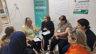 Iqbal Elias Al-Touni, during a group discussion with women from her community. Photo credit: Women for Women International.