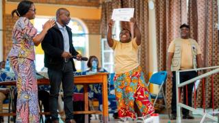 Faida celebrates receiving her certificate at the Stronger Women, Stronger Nations programme graduation ceremony. Photo: Patrick Luhiriri