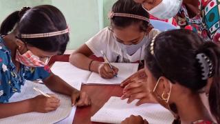 Adolescent girls attending a non-formal education class facilitated by a community teacher. Photo: Women for Women International