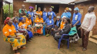 Change Agents (in orange t-shirts) gather for a meeting. Credit: Monilekan