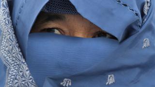 An Afghan woman with her face covered