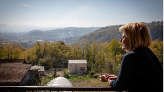 Amela looking out over her garden. Photo credit: Hazel Thompson.