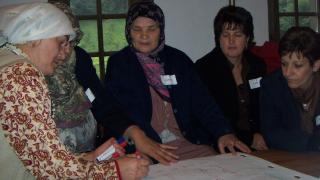 Women for Women International participants come together to learn and support one another.
