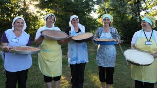 Programme graduates from Kosovo with a range of freshly baked breads. Photo: Simon Wheeler