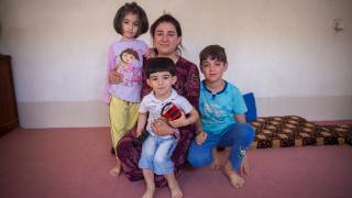 Kabira Habash, 40, with her two children and her nephew in her home