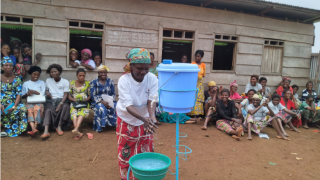Women for Women International programme participants take part in a hand washing demonstration during Ebola epidemic in the Democratic Republic of Congo.  