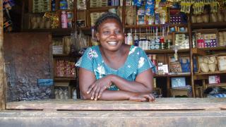 A Stronger Women, Stronger Nations programme graduate in her store. Photo: Women for Women International