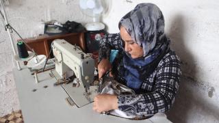 Shireen, Women for Women International-Iraq participant, runs a sewing business from her home. Many self-employed women and traders are being hit hard by the closure of markets. Photo: Alison Baskerville