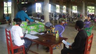 Women for Women International staff distribute soap and stipends to participants in Yei, South Sudan. Photo: Women for Women International