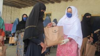 Distributing hygiene kits in Afghanistan during COVID-19. Photo: Women for Women International