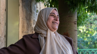 Close up image of Tahani smiling