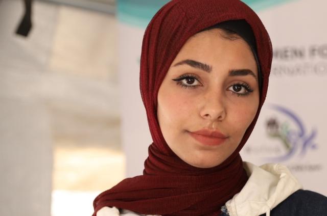 Hijabi woman (Rania) pictured from head up with white background
