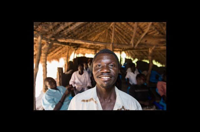 Yaungson Yakani Francis poses in class after standing up to answer a question in his men's engagement training. 