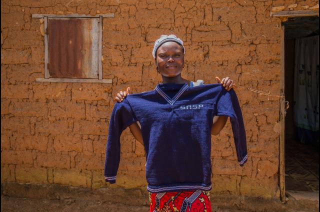 Faith Mathew holding up a jumper